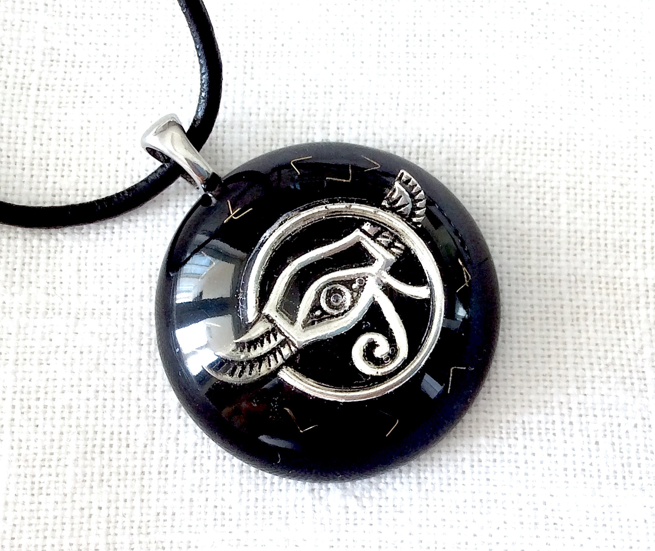 Orgone energy pendant necklace silver Eye of Horus, Black Tourmaline & Shungite. EMF protection. 1.2 inches diameter. Made in USA