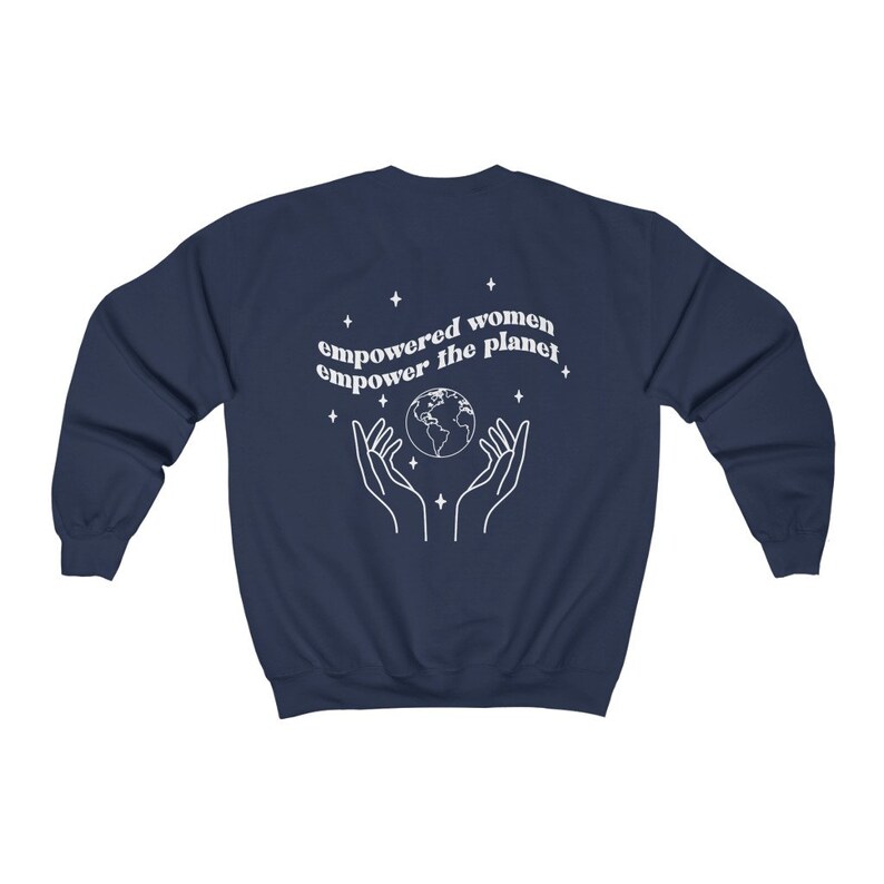 May include: Navy blue sweatshirt with a white graphic of hands holding a globe and the text "empowered women empower the planet".