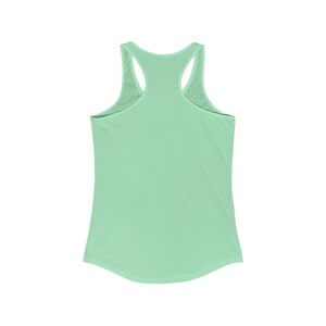 May include: A light green sleeveless tank top with a scoop neck and racerback.