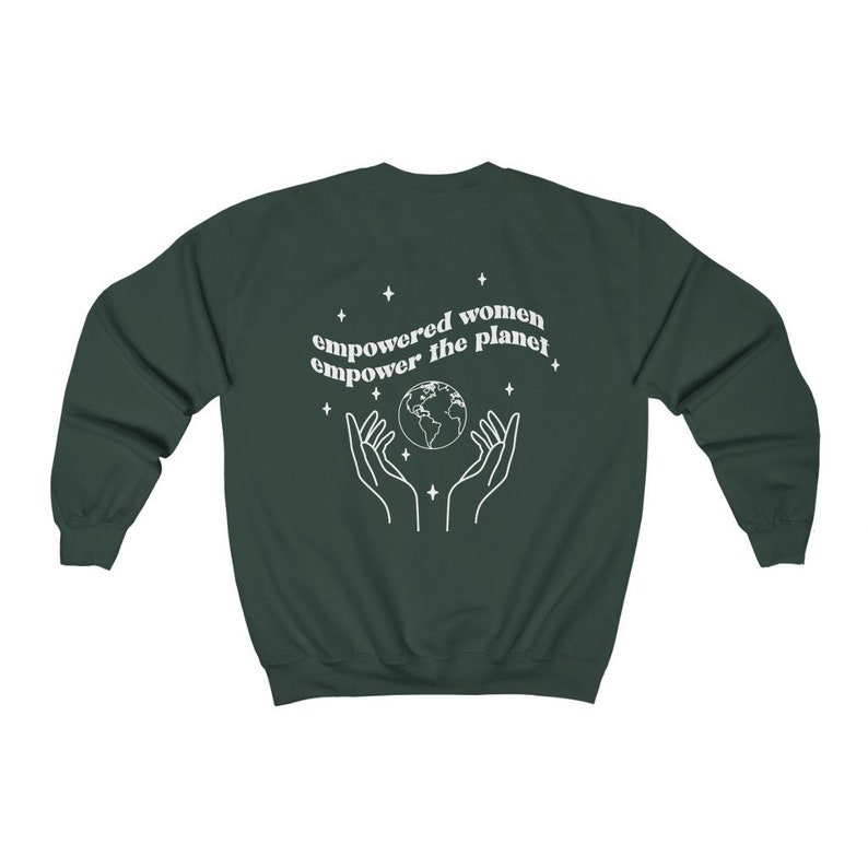 May include: A dark green sweatshirt with the text "empowered women empower the planet" in white. The text is surrounded by small stars and a graphic of two hands holding a globe.