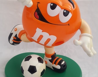 M&M’s Soccer Player Plain Orange on Green base Dispenser Awesome and Unique