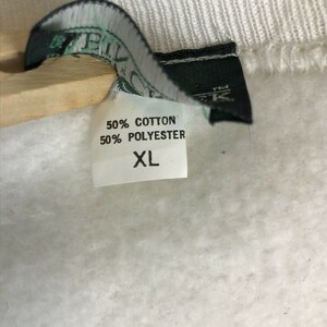 May include: A white tag with black text that reads "50% Cotton 50% Polyester XL".