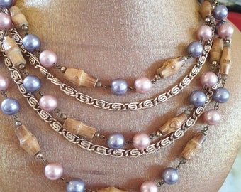 Beaded necklace 1950s. Five strands of ornate goldtone chain and silver/pink round beads, with pearlesque finish, and bamboo beads.