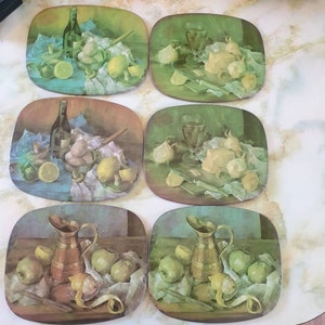 Placemats 1960s set of 6. Graphics of food and wine. Have cork backing.