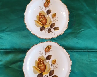 Small dishes 1950s. Set of 2 pin/trinket dishes. Regency English bone china. White edged with gold, adorned with yellow roses design.