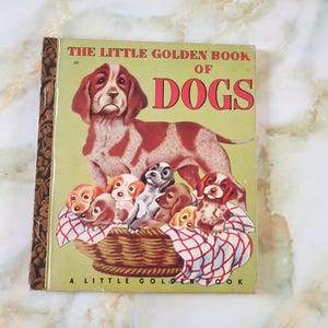 Książka dla dzieci z lat 50. The Little Golden Book Of Dogs. The Golden Press Sydney. Twarda okładka.