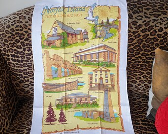 Tea towel 1980s souvenir of Norfolk Island. The fascinating Past design. 100% cotton. Designed in Australia by Visit Merchandise.