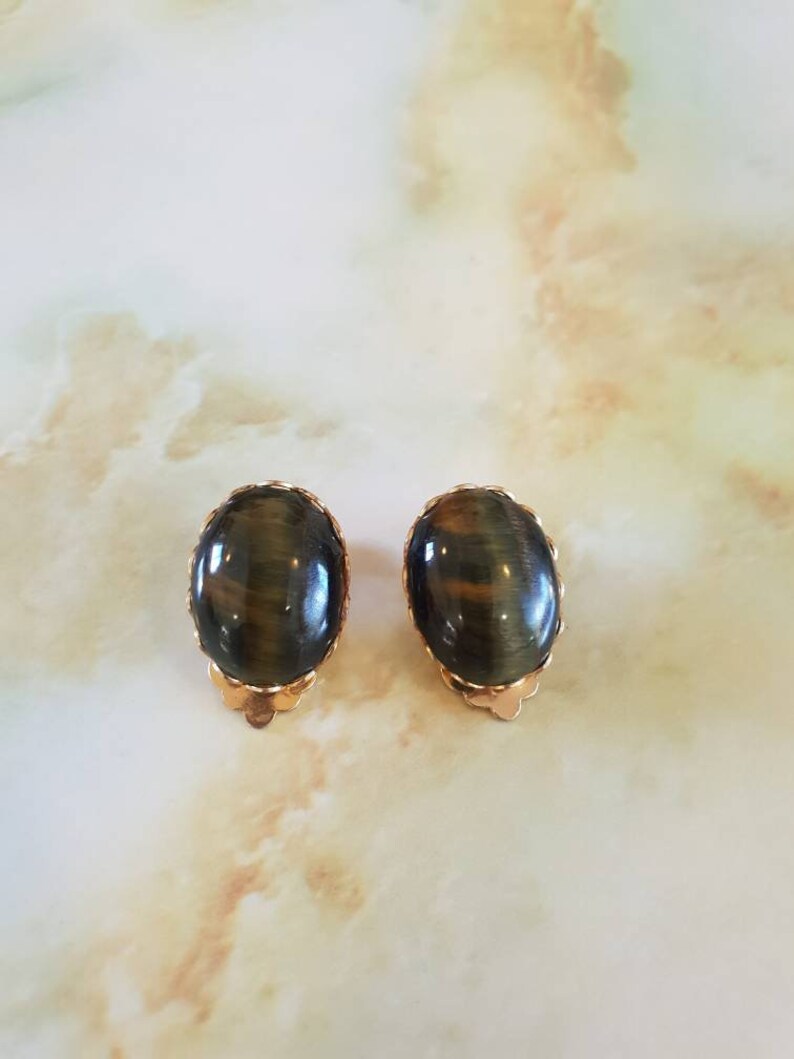 Earings 1950/'s clip on Ornate goldtone framing a tigers eye stone centre.