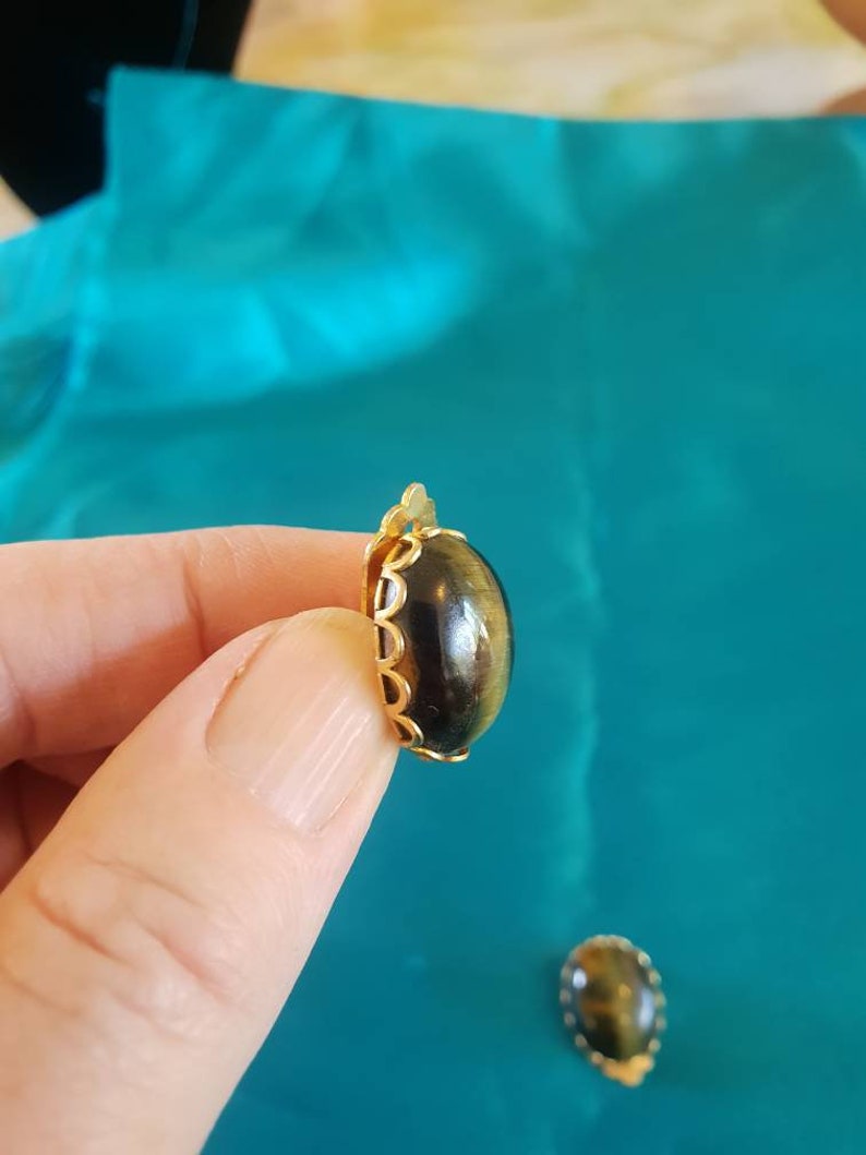 Earings 1950/'s clip on Ornate goldtone framing a tigers eye stone centre.