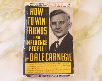 Book, How to Win Friends and Influence People,  by Dale Carnegie. This copy is number 3114273. Printed in 1945. Paper back.