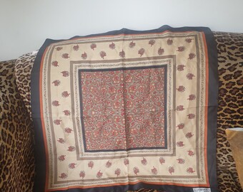 Scarve 1970s. Square in shape. J' Dormont Paris. Polyester. Italian fabric. Label is Miss Helen Paris. Paisley design.