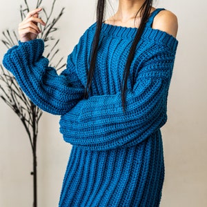 TCDDIY crochet pattern for a single strap sweater dress featuring balloon sleeves and a customizable length, crafted using Caron One Pound yarn in Ocean.