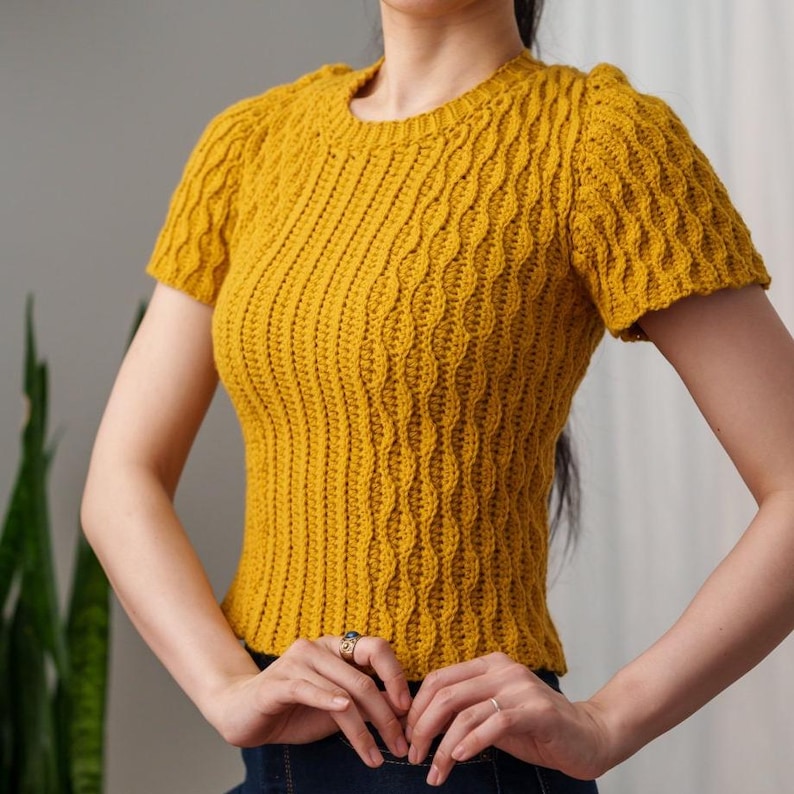 TCDDIY crochet pattern for a modern short sleeve crew neck t-shirt with almond stitch detail, crafted using Lion Brand Pound of Love yarn in Maize.