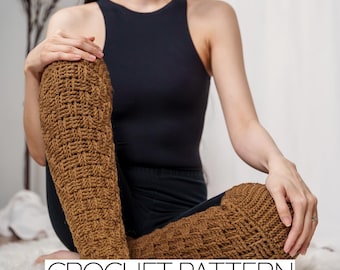 May include: A close-up of a person wearing brown crochet leg warmers. The leg warmers are made with a simple stitch pattern and have a textured look. The text "CROCHET PATTERN" is visible at the bottom of the image.