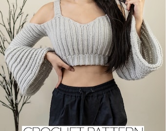May include: A gray crochet crop top with bell sleeves and a scoop neck. The top is shown on a model with black pants. The text "CROCHET PATTERN" is at the bottom of the image.