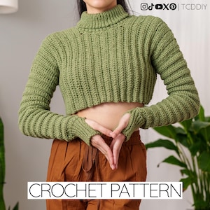 May include: A green, cropped crochet sweater with a turtleneck and long sleeves. The sleeves have thumb holes. The text "CROCHET PATTERN" is displayed in a white font at the bottom of the image. Social media handles are in the top right corner.
