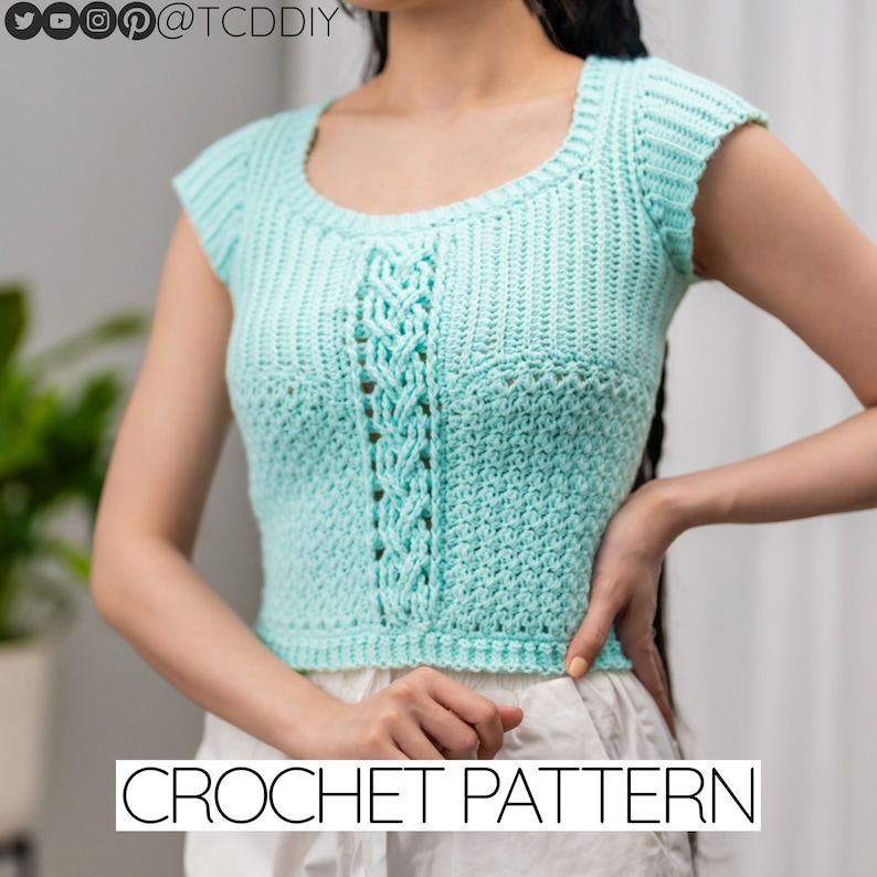 TCDDIY crochet pattern for a short sleeve cable stitch top with ribbing, featuring a cozy Suzette stitch texture, made using Lion Brand Pound of Love yarn in Pastel Green.