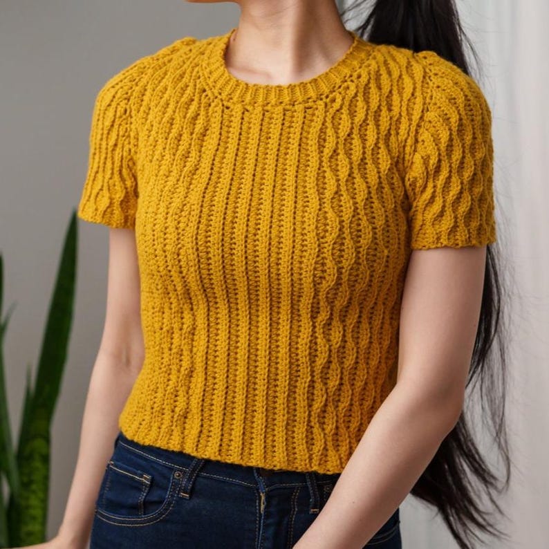 TCDDIY crochet pattern for a modern short sleeve crew neck t-shirt with almond stitch detail, crafted using Lion Brand Pound of Love yarn in Maize.