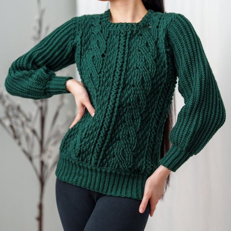 TCDDIY crochet pattern for a classic cropped crewneck sweater featuring cable and alpine stitches with ribbing details, made using Big Twist Soft yarn in Hunter Green.