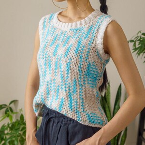 TCDDIY crochet pattern for an easy moss stitch tank top with a slouchy fit, beginner-friendly, crafted using Bernat Baby Sport yarn in Popsicle Blue and White.