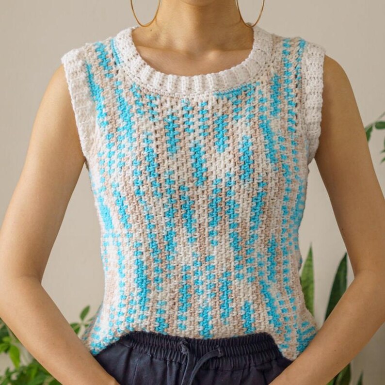 TCDDIY crochet pattern for an easy moss stitch tank top with a slouchy fit, beginner-friendly, crafted using Bernat Baby Sport yarn in Popsicle Blue and White.