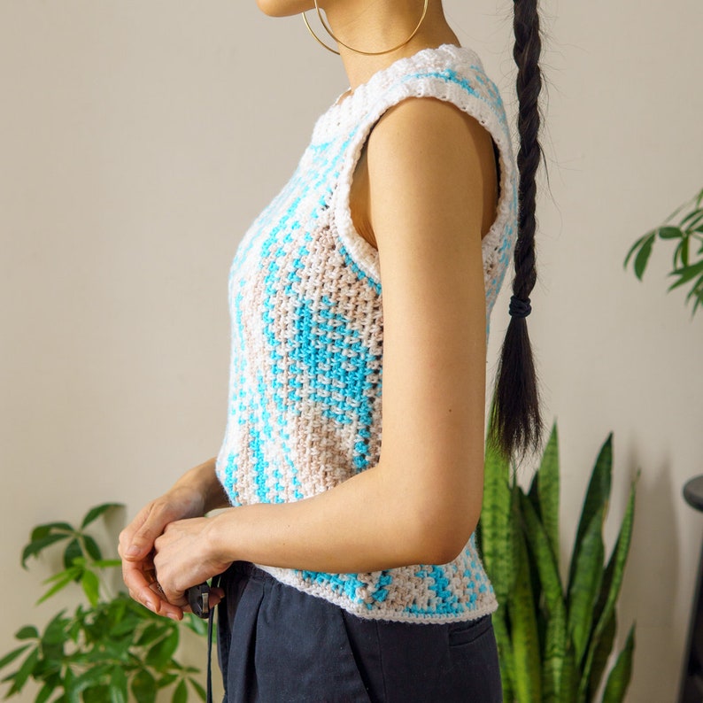 TCDDIY crochet pattern for an easy moss stitch tank top with a slouchy fit, beginner-friendly, crafted using Bernat Baby Sport yarn in Popsicle Blue and White, side view.