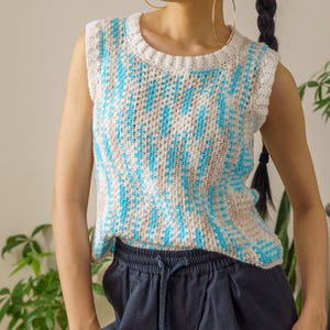 TCDDIY crochet pattern for an easy moss stitch tank top with a slouchy fit, beginner-friendly, crafted using Bernat Baby Sport yarn in Popsicle Blue and White.