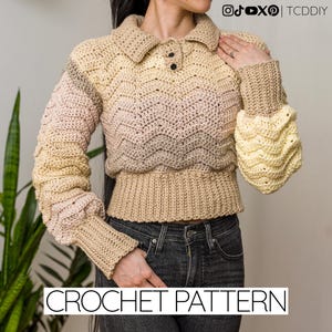 May include: A crocheted sweater with a collared neckline and long sleeves. The sweater features a color gradient from light beige to pale pink and yellow. The text "CROCHET PATTERN" is displayed at the bottom.