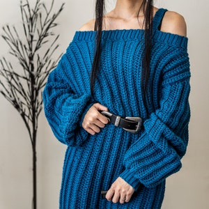 TCDDIY crochet pattern for a single strap sweater dress featuring balloon sleeves and a customizable length, crafted using Caron One Pound yarn in Ocean.