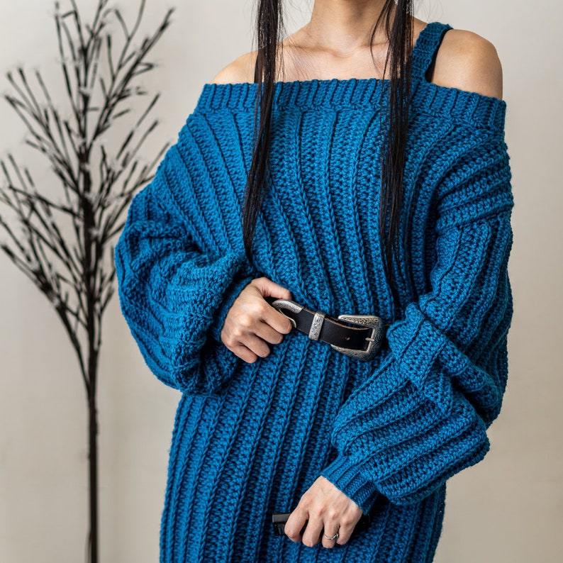 TCDDIY crochet pattern for a single strap sweater dress featuring balloon sleeves and a customizable length, crafted using Caron One Pound yarn in Ocean.