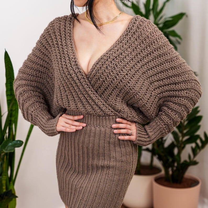 TCDDIY crochet pattern for a batwing wrap sweater dress with ribbed cuffs and fitted skirt, crafted with Lion Brand Pound of Love in Taupe.
