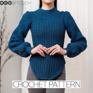 May include: A blue crochet sweater with a high neck and long sleeves. The sweater has a fitted bodice and a slightly flared hem. CROCHET PATTERN is written in white text at the bottom of the image.