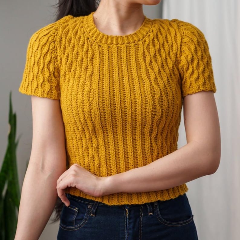 TCDDIY crochet pattern for a modern short sleeve crew neck t-shirt with almond stitch detail, crafted using Lion Brand Pound of Love yarn in Maize.