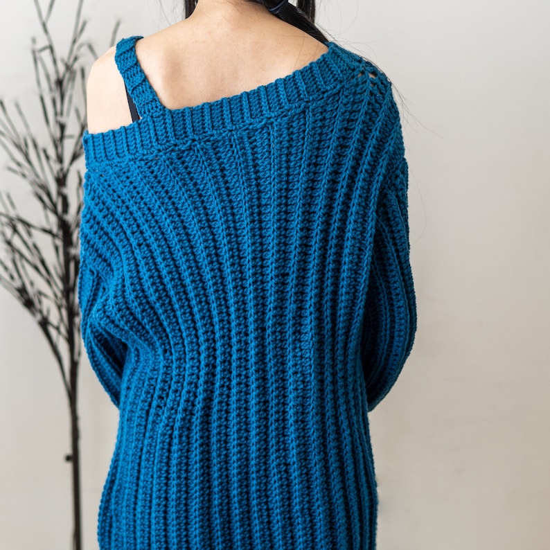 TCDDIY crochet pattern for a single strap sweater dress featuring balloon sleeves and a customizable length, crafted using Caron One Pound yarn in Ocean, back view.