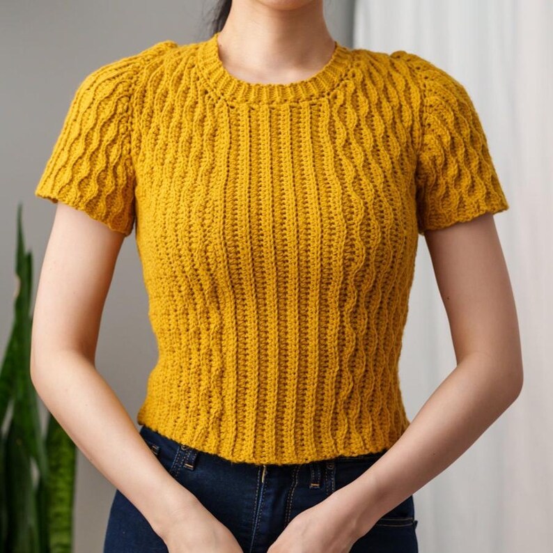 TCDDIY crochet pattern for a modern short sleeve crew neck t-shirt with almond stitch detail, crafted using Lion Brand Pound of Love yarn in Maize.