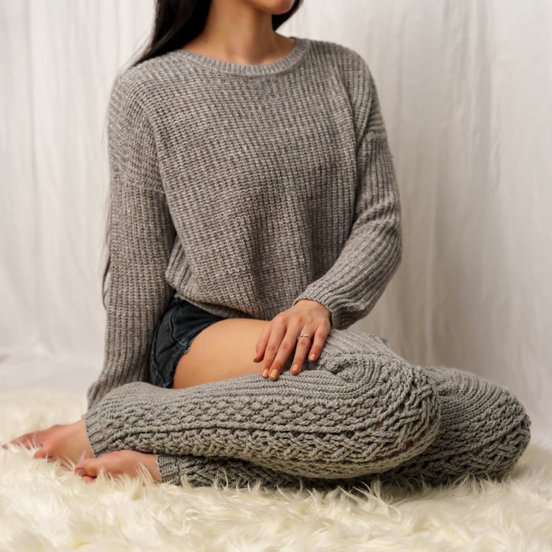 TCDDIY crochet pattern for Cable Stitch Leg Warmers featuring Alpine stitch detail and a knee-high fit, crafted using Caron One Pound yarn in Soft Grey Mix.