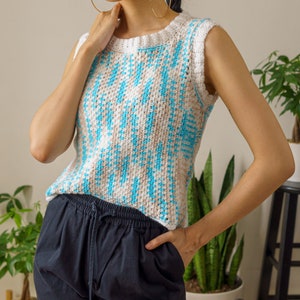 TCDDIY crochet pattern for an easy moss stitch tank top with a slouchy fit, beginner-friendly, crafted using Bernat Baby Sport yarn in Popsicle Blue and White.