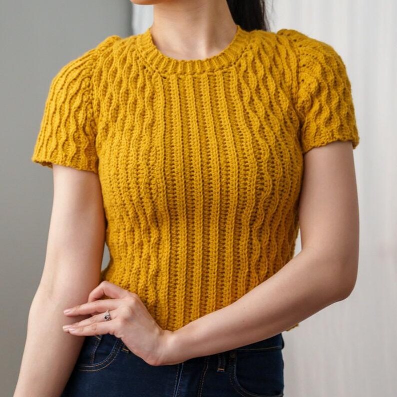 TCDDIY crochet pattern for a modern short sleeve crew neck t-shirt with almond stitch detail, crafted using Lion Brand Pound of Love yarn in Maize.