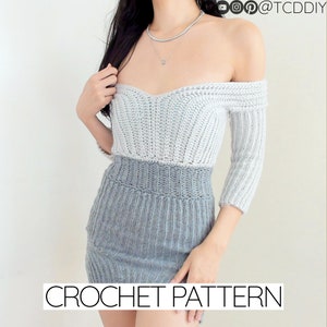 May include: A crochet dress pattern featuring a two-toned design with a white top and a gray bottom. The dress has an off-the-shoulder neckline and three-quarter sleeves. The pattern is available for download. CROCHET PATTERN