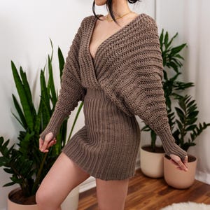 TCDDIY crochet pattern for a batwing wrap sweater dress with ribbed cuffs and fitted skirt, crafted with Lion Brand Pound of Love in Taupe.