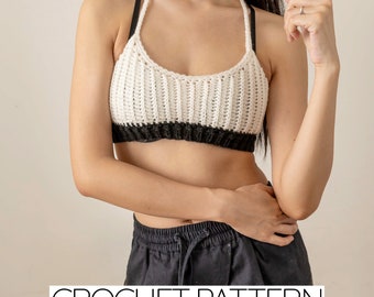 May include: A crochet top with a white and black color block design. The top has a halter style neckline and is made with a simple stitch pattern. CROCHET PATTERN is written in white text on a black background at the bottom of the image.