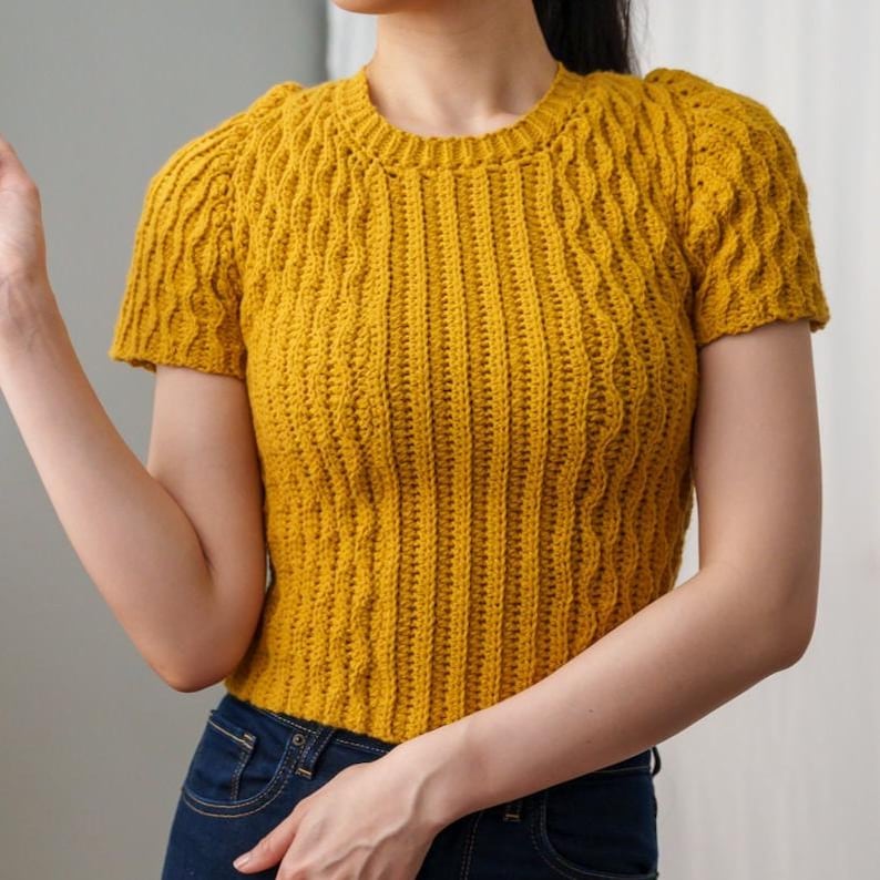 TCDDIY crochet pattern for a modern short sleeve crew neck t-shirt with almond stitch detail, crafted using Lion Brand Pound of Love yarn in Maize.