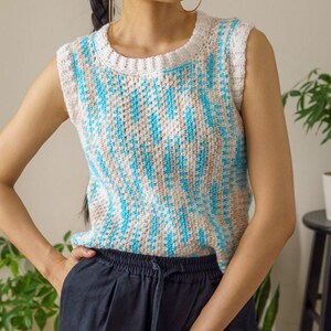 TCDDIY crochet pattern for an easy moss stitch tank top with a slouchy fit, beginner-friendly, crafted using Bernat Baby Sport yarn in Popsicle Blue and White.