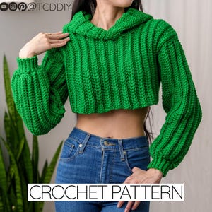 May include: A green crochet hooded crop top with long sleeves. CROCHET PATTERN is written in white text at the bottom of the image.