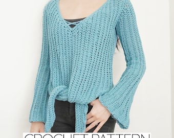 May include: A light blue crochet top with a tie at the waist and bell sleeves. The top is made with a simple stitch pattern and has a v-neck.