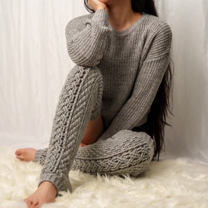 TCDDIY crochet pattern for Cable Stitch Leg Warmers featuring Alpine stitch detail and a knee-high fit, crafted using Caron One Pound yarn in Soft Grey Mix.
