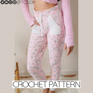 May include: Crochet pattern for pink and white striped pants with a white pocket. The pants have a drawstring waistband.