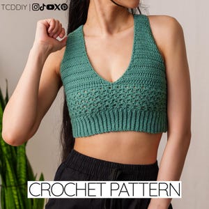May include: A teal green crochet halter top with a V-neck design. The top features a textured stitch pattern and a ribbed hem. The words "CROCHET PATTERN" are displayed in white text at the bottom of the image.