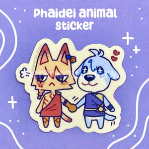 May include: A sticker featuring two cartoon animals holding hands. One is an orange cat wearing a red tunic, and the other is a blue dog wearing a blue tunic. The sticker has the text "Phaidei animal STICKER" at the top.