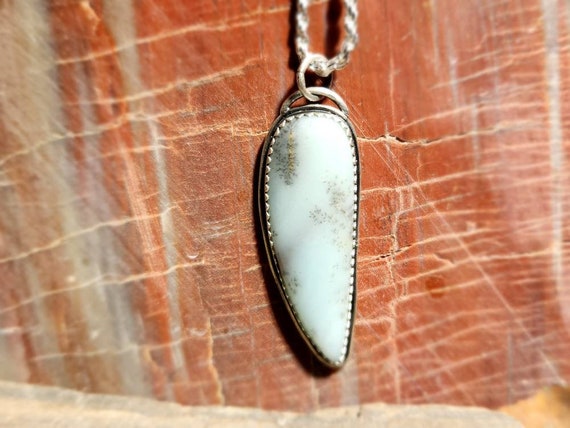 A georgious  aqua colored dendritic agate set in a simple and rustic sterling silver pendant !!